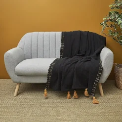 Jeté de canapé surpiqué pompons noir 130x150 cm