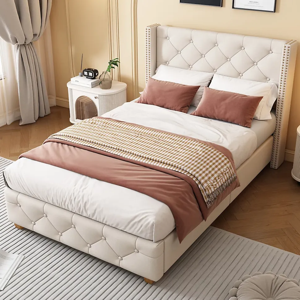 Lit 90x200 cm tapissé lin beige avec tête de lit capitonnée, clous décoratifs et pieds en bois renforcés